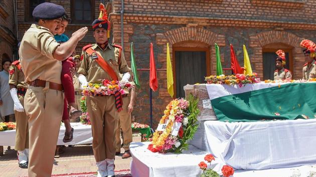 Police officer Arshad Khan's son Abuhan Khan pays tribute to his father during a wreath-laying ceremony at District Police Lines, in Srinagar, Jammu and Kashmir. Khan, who was SHO of police station Sadar in Anantnag, was injured in a suicide attack by militants on June 12 and succumbed to injuries at AIIMS Delhi. (S Irfan / PTI) Police officer Arshad Khan's son Abuhan Khan pays tribute to his father during a wreath-laying ceremony at District Police Lines, in Srinagar, Jammu and Kashmir. Khan, who was SHO of police station Sadar in Anantnag, was injured in a suicide attack by militants on June 12 and succumbed to injuries at AIIMS Delhi. (S Irfan / PTI)
