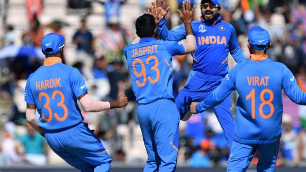 India's players celebrate after the dismissal of Afghanistan's Hashmatullah Shahidi.(AFP)