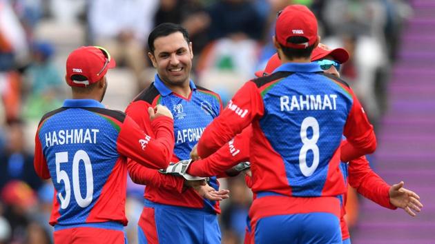 Afghanistan's Mohammad Nabi (C) celebrates with teammates. (AFP)