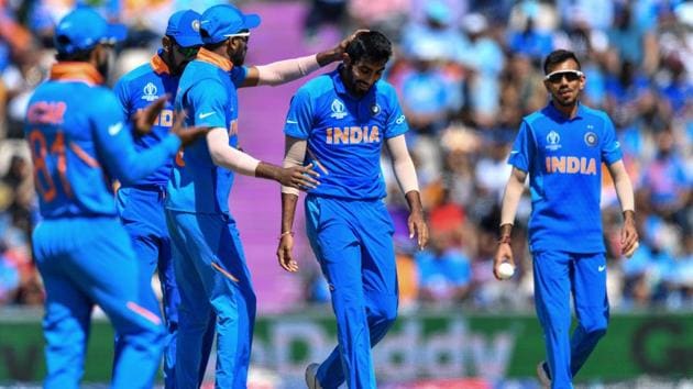 India's Jasprit Bumrah (C) is congratulated by teammates. (AFP)