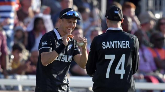 New Zealand's Trent Boult (L) celebrates with New Zealand's Mitchell Santner(AFP)