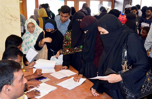 Investors register their complaints against IMA (I Monetary Advisory) jewellery fraud at a temporary police post set up at Shivajinagar, in Bengaluru on June 12.(PTI)