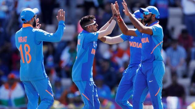 India's Vijay Shankar celebrates with team mates after taking the catch to dismiss Afghanistan's Gulbadin Naib. (Action Images via Reuters)