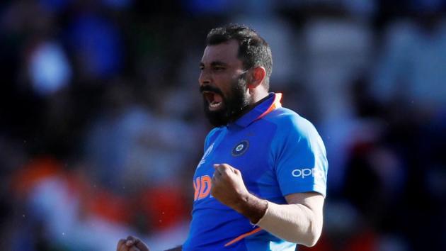 India's Mohammed Shami celebrates taking the wicket of Afghanistan's Mujeeb Ur Rahman to complete a hat trick and win the match(Action Images via Reuters)