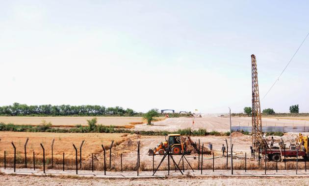 Heavy machines at work beyond the border fence for the construction of the Indian side of Kartarpur corridor, in Gurdaspur district, Monday, April 29, 2019. (PTI file photo) Heavy machines at work beyond the border fence for the construction of the Indian side of Kartarpur corridor, in Gurdaspur district, Monday, April 29, 2019. (PTI file photo)