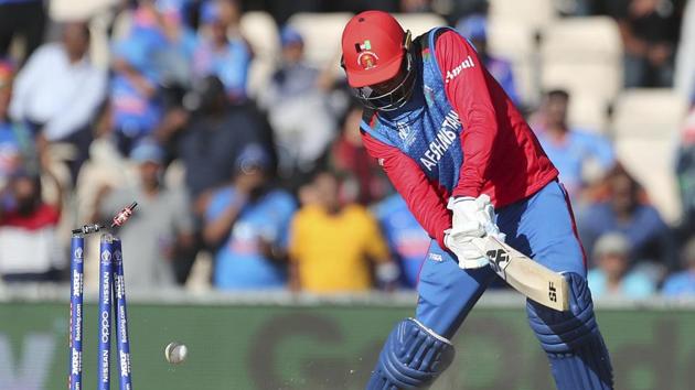 Afghanistan's Mujeeb Ur Rahman is bowled out by India's Mohammed Shami. (AP)