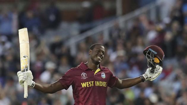 West Indies' Carlos Brathwaite celebrates after scoring a century during the Cricket World Cup match between New Zealand and West Indies at Old Trafford in Manchester, England, Saturday, June 22, 2019 (AP)
