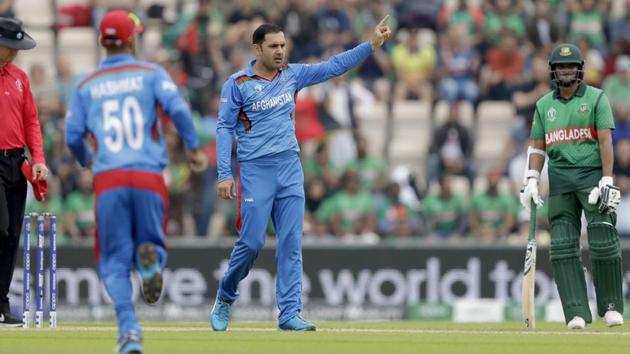 Afghanistan's Mohammad Nabi celebrates taking the wicket of Bangladesh's Tamim Iqbal. (AP)