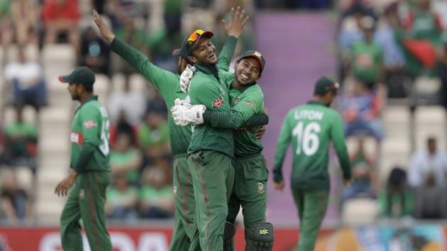 Bangladesh's Shakib Al Hasan, left, and Bangladesh's Mushfiqur Rahim celebrate after the wicket of Afghanistan's Rashid Khan. (AP)