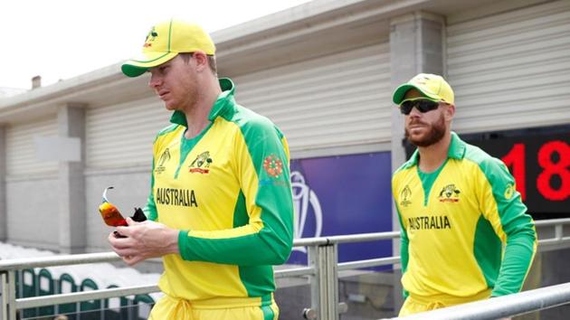 Australia's Steve Smith and David Warner walk out for the start of play(Action Images via Reuters)