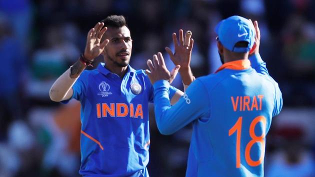 India's Yuzvendra Chahal celebrates taking the wicket of Afghanistan's Rashid Khan with Virat Kohli(Action Images via Reuters) India's Yuzvendra Chahal celebrates taking the wicket of Afghanistan's Rashid Khan with Virat Kohli(Action Images via Reuters)