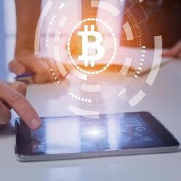 Team of financial people trading, investing or paying with bitcoin cryptocurrency technology, BTC currency symbol on virtual interface, digital tablet computer(Getty Images/iStockphoto)