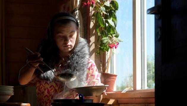 Natasha, 21, who has Down syndrome, serves lunch to residents of the Svetlana farm outside the settlement of Aleksino, Russia. On a warm sunny day, 37-year-old Vika walked through a farmyard carrying a compost bin, saying to AFP with pride: “This is my job.” She’s one of 18 Russians with learning disabilities to live and work on the Svetlana farm which has a dairy and bakery where residents do daily chores and therapy. (Olga Maltseva / AFP)