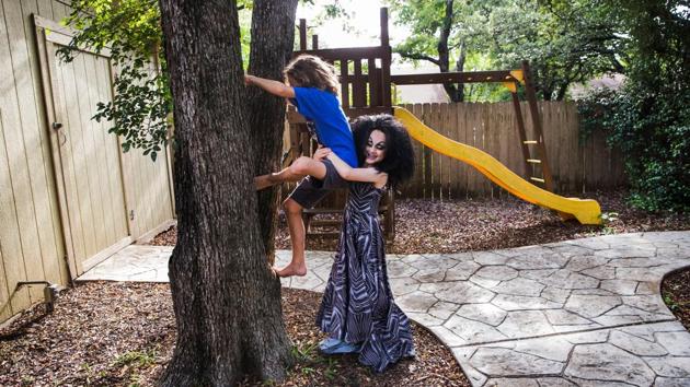 Keegan (R), plays with his older brother, Noah, 10, outside their family home following a drag lesson with his drag queen mentors. Keegan's parents say he often remains in full drag until bed time. By one survey nearly 3% of youth in Minnesota fall under these categories, identifying with neither gender, or both, or trans, or just defying a traditional male/female binary option. (Amanda Voisard / REUTERS) Keegan (R), plays with his older brother, Noah, 10, outside their family home following a drag lesson with his drag queen mentors. Keegan's parents say he often remains in full drag until bed time. By one survey nearly 3% of youth in Minnesota fall under these categories, identifying with neither gender, or both, or trans, or just defying a traditional male/female binary option. (Amanda Voisard / REUTERS)