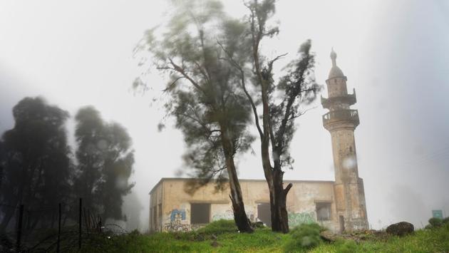 An abandoned mosque is seen on a rainy morning in the Golan Heights, in territory that Israel captured from Syria and occupied in the 1967 Middle East war. Until 1967 a Syrian village inhabited by Circassians stood near the site, which now lies just 5km on the Israeli side of the United Nations-monitored ‘Area of Separation’ that divides Israeli and Syrian military forces under a 1974 ceasefire arrangement. (Ronen Zvulun / REUTERS) An abandoned mosque is seen on a rainy morning in the Golan Heights, in territory that Israel captured from Syria and occupied in the 1967 Middle East war. Until 1967 a Syrian village inhabited by Circassians stood near the site, which now lies just 5km on the Israeli side of the United Nations-monitored ‘Area of Separation’ that divides Israeli and Syrian military forces under a 1974 ceasefire arrangement. (Ronen Zvulun / REUTERS)