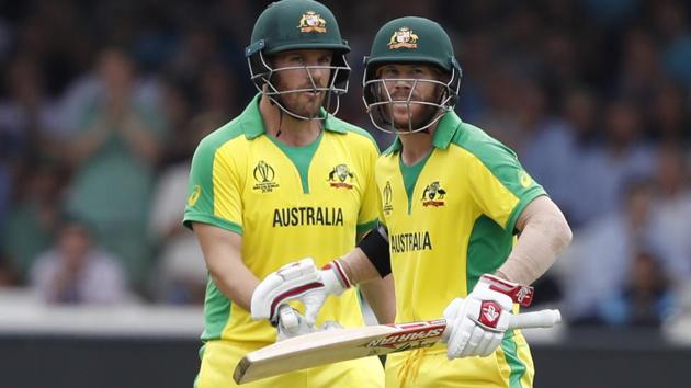 Australia's David Warner, right celebrates with teammate Aaron Finch.(AP)