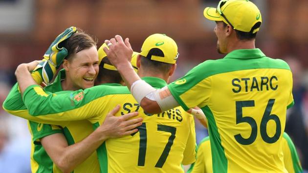 Australia's Jason Behrendorff (L) celebrates with teammates after the dismissal of England's Jofra Archer. (AFP)