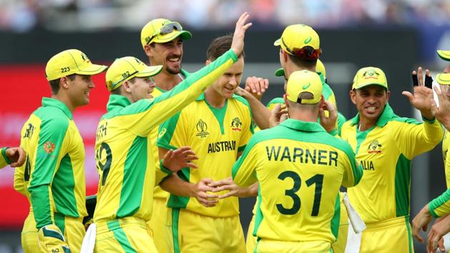 Australia's Jason Behrendorff and teammates celebrate taking the wicket of England's Chris Woakes. (Action Images via Reuters)