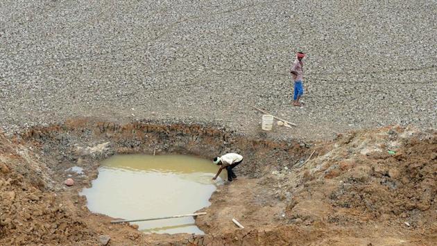 A worker collects the last bit of water in the final pond at the dried-out Puzhal Reservoir. Chennai gets most of its water from four lakes around the city. But it had a poor monsoon last year and levels have not recovered since. The bones of dead fish now lie on the cracked bottoms of the lakes. While weak rainfall is a key cause of the crisis, experts say India’s poor record at collecting water does not help. (Arun Sankar / AFP) A worker collects the last bit of water in the final pond at the dried-out Puzhal Reservoir. Chennai gets most of its water from four lakes around the city. But it had a poor monsoon last year and levels have not recovered since. The bones of dead fish now lie on the cracked bottoms of the lakes. While weak rainfall is a key cause of the crisis, experts say India’s poor record at collecting water does not help. (Arun Sankar / AFP)