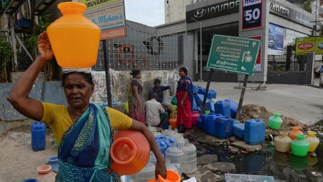 Residents wait with plastic pots at a water distribution point in Chennai. Most of those queuing are women, including housewife Nagammal Mani, who said looking for water was like “a full time job”. “You need one person at home just to find and fill up the water while the other person goes to work,” she said. (Arun Sankar / AFP) Residents wait with plastic pots at a water distribution point in Chennai. Most of those queuing are women, including housewife Nagammal Mani, who said looking for water was like “a full time job”. “You need one person at home just to find and fill up the water while the other person goes to work,” she said. (Arun Sankar / AFP)