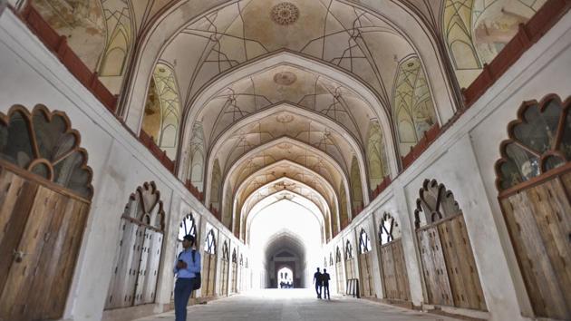 At the Chhatta bazaar, once a market catering to the imperial household, wooden framed doorways topped with Mughal styled arches have replaced the old shutters. Archival images were studied and paintings on the ceilings of the market, hidden beneath six to seven coats of lime, were restored to give a feel of the Mughal era, said Dr. N K Pathak, superintending archaeologist in ASI Delhi circle. (Burhaan Kinu / HT Photo)
