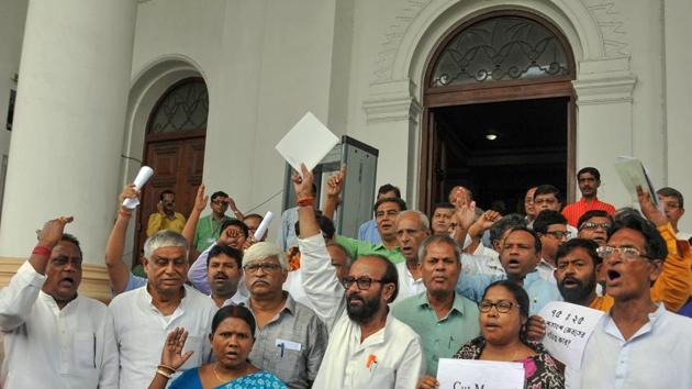 Congress and CPI(M) MLAs raise slogans as they walk out to protest against 'cut money' allegedly taken by the Trinamool Congress leaders and workers, at West Bengal legislative assembly, in Kolkata, Tuesday, June 25, 2019. (PTI Photo) Congress and CPI(M) MLAs raise slogans as they walk out to protest against 'cut money' allegedly taken by the Trinamool Congress leaders and workers, at West Bengal legislative assembly, in Kolkata, Tuesday, June 25, 2019. (PTI Photo)