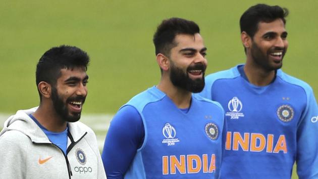 India's captain Virat Kohli, center, Jasprit Bumrah, left, and Bhuvneshwar Kumar attend a training session.(AP)