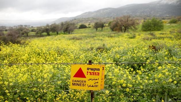 A sign warning of landmines is seen on a fence in the Golan Heights. Many tourists drive past the site on their way to popular holiday spots. Since the end of British Mandate rule and the creation of the modern state of Israel in 1948, invasions, wars, armistices, treaties, uprisings, barriers, checkpoints and civil wars have shifted the boundaries of who can travel - and live - where. (Ronen Zvulun / REUTERS) A sign warning of landmines is seen on a fence in the Golan Heights. Many tourists drive past the site on their way to popular holiday spots. Since the end of British Mandate rule and the creation of the modern state of Israel in 1948, invasions, wars, armistices, treaties, uprisings, barriers, checkpoints and civil wars have shifted the boundaries of who can travel - and live - where. (Ronen Zvulun / REUTERS)