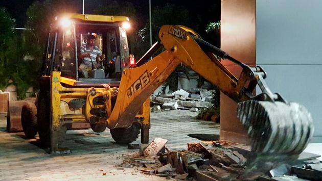 Demolition of a building adjacent to former Andhra CM N Chandrababu Naidu’s residence in Amaravati continued in full swing amid tension and tight security on Wednesday, as the Andhra Pradesh High Court rejected the plea to put a stay on the demolition. After razing structures on Tuesday night, officials began demolishing the main building of ‘Praja Vedika’ built by then Chief Minister Naidu in 2017 to hold official meetings. (PTI) Demolition of a building adjacent to former Andhra CM N Chandrababu Naidu’s residence in Amaravati continued in full swing amid tension and tight security on Wednesday, as the Andhra Pradesh High Court rejected the plea to put a stay on the demolition. After razing structures on Tuesday night, officials began demolishing the main building of ‘Praja Vedika’ built by then Chief Minister Naidu in 2017 to hold official meetings. (PTI)