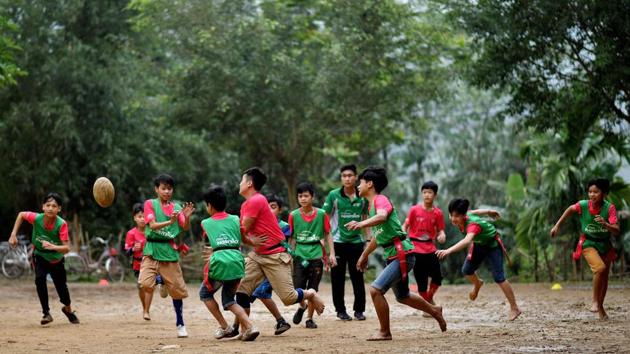 Boys mid-match in the Kim Boi district. Battling inequality wasn’t the only hurdle. There was no vocabulary in Vietnamese for the sport and some terms were coined on the fly. A scrum is “mai rua” which means ‘turtle shell’ in Vietnamese, while the name for rugby is simply “bong bau duc”, which translates to ‘oval ball’. (Manan Vaytsyayana / AFP) Boys mid-match in the Kim Boi district. Battling inequality wasn’t the only hurdle. There was no vocabulary in Vietnamese for the sport and some terms were coined on the fly. A scrum is “mai rua” which means ‘turtle shell’ in Vietnamese, while the name for rugby is simply “bong bau duc”, which translates to ‘oval ball’. (Manan Vaytsyayana / AFP)