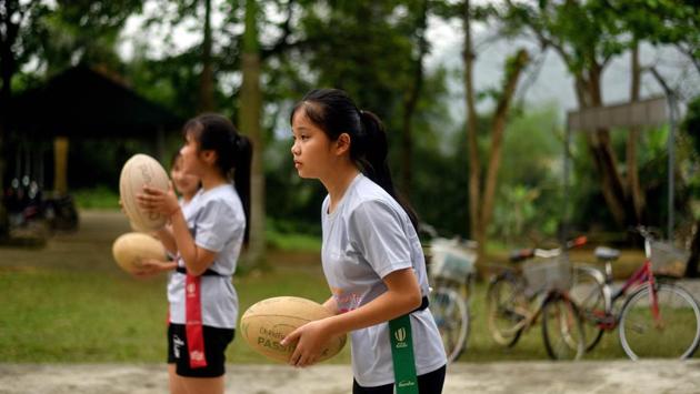 Vietnam is one of few Southeast Asian countries with no rugby federation, and international games aren’t regularly aired on television. The sport remains on the margins, making the rugby clinic something of an oddity. Launched in 2015, the ChildFund Pass It Back programme is aimed at teaching youngsters life skills, with lessons on health or planning for the future interspersed with rugby training sessions. (Manan Vaytsyayana / AFP) Vietnam is one of few Southeast Asian countries with no rugby federation, and international games aren’t regularly aired on television. The sport remains on the margins, making the rugby clinic something of an oddity. Launched in 2015, the ChildFund Pass It Back programme is aimed at teaching youngsters life skills, with lessons on health or planning for the future interspersed with rugby training sessions. (Manan Vaytsyayana / AFP)