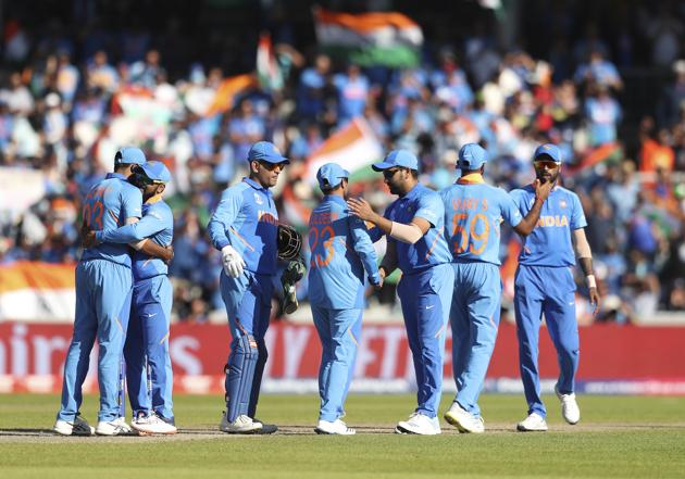 Indian cricketers celebrate their victory at the end of the Cricket World Cup match between India and West Indies at Old Trafford in Manchester (AP)