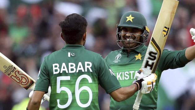 Pakistan's batsman Haris Sohail, right, embraces teammate Pakistan's batsman Babar Azam for scoring a century. (AP)