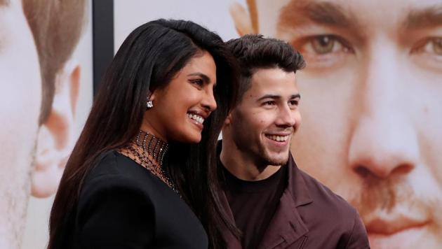 Priyanka Chopra and Nick Jonas arrive at the premiere for the documentary Chasing Happiness in Los Angeles.(REUTERS)