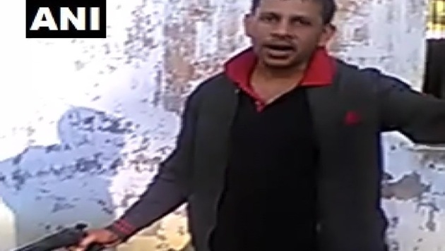 Two jail inmates were seen brandishing a firearm inside the Unnao jail in a video widely shared on social media. (ANI / Twitter) Two jail inmates were seen brandishing a firearm inside the Unnao jail in a video widely shared on social media. (ANI / Twitter)