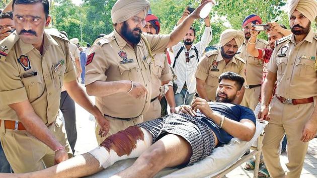 One of the injured inmates being brought to the civil hospital after the clash at the central jail in Ludhiana.(Gurminder Singh/HT Photo)