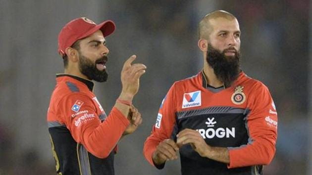 Royal Challengers Bangalore bowler Moeen Ali (R) celebrates with team captain Virat Kohli (L). (AFP) Royal Challengers Bangalore bowler Moeen Ali (R) celebrates with team captain Virat Kohli (L). (AFP)