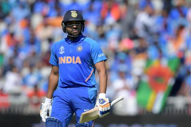 India's Rohit Sharma leaves the pitch after losing his wicket for 18 during the 2019 Cricket World Cup group stage match between West Indies and India at Old Trafford in Manchester, northwest England, on June 27, 2019. (Photo by Dibyangshu Sarkar / AFP) / RESTRICTED TO EDITORIAL USE(AFP)