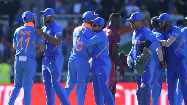 Indian players congratulate each other after their victory against West Indies at Manchester on Thursday.(AFP)