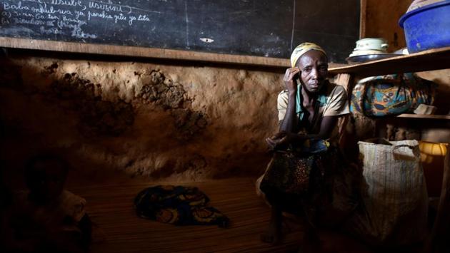 An internally displaced Congolese woman and her child sit inside a classroom used by victims of ethnic violence in Iga Barriere, Ituri province, in the eastern Democratic Republic of Congo. (Olivia Acland / REUTERS) An internally displaced Congolese woman and her child sit inside a classroom used by victims of ethnic violence in Iga Barriere, Ituri province, in the eastern Democratic Republic of Congo. (Olivia Acland / REUTERS)