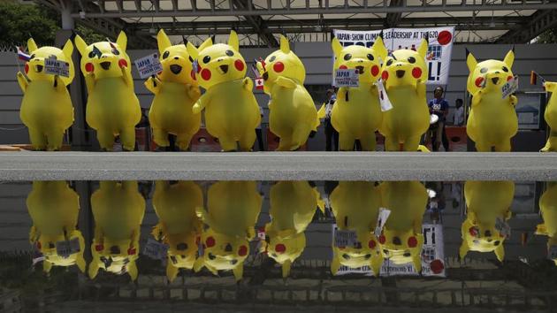 Environmental activists wearing Pikachu costumes hold a rally in front of the Japanese embassy in Manila, Philippines. The group was challenging Japan to stop financing coal as it prepared to host the Group of 20 leaders summit. (Aaron Favila / AP) Environmental activists wearing Pikachu costumes hold a rally in front of the Japanese embassy in Manila, Philippines. The group was challenging Japan to stop financing coal as it prepared to host the Group of 20 leaders summit. (Aaron Favila / AP)