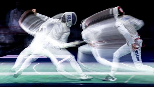 A long exposure photo made using the zoom effect shows France’s Pauline Ranvier (L) and Russia’s Inna Deriglasowa competeing in the 2019 Fencing European Championships in Duesseldorf, western Germany. (Marius Becker / dpa / AFP) A long exposure photo made using the zoom effect shows France’s Pauline Ranvier (L) and Russia’s Inna Deriglasowa competeing in the 2019 Fencing European Championships in Duesseldorf, western Germany. (Marius Becker / dpa / AFP)