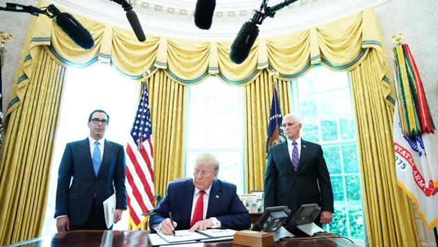 US President Donald Trump signs with US Vice President Mike Pence (R) and US Secretary of Treasury Steven Mnuchin at the White House, “hard-hitting sanctions” on Iran's supreme leader Ayatollah Ali Khamenei and other officials, blocking “literally billions” in Iranian assets, Mnuchin said. The sanctions target eight top military commanders as well. (Mandel Ngan / AFP) US President Donald Trump signs with US Vice President Mike Pence (R) and US Secretary of Treasury Steven Mnuchin at the White House, “hard-hitting sanctions” on Iran's supreme leader Ayatollah Ali Khamenei and other officials, blocking “literally billions” in Iranian assets, Mnuchin said. The sanctions target eight top military commanders as well. (Mandel Ngan / AFP)