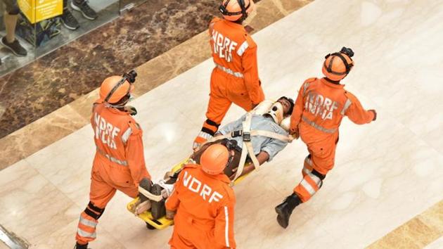 Members of the National Disaster Response Force (NDRF) during a mock exercise to prepare for the situation of an earthquake, at V3S Mall, Laxmi Nagar, in New Delhi (Sanchit Khanna / Hindustan Times) Members of the National Disaster Response Force (NDRF) during a mock exercise to prepare for the situation of an earthquake, at V3S Mall, Laxmi Nagar, in New Delhi (Sanchit Khanna / Hindustan Times)