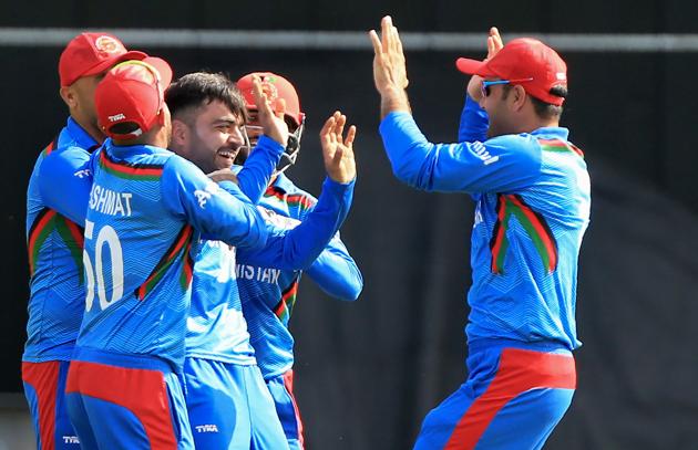 Afghanistan's Rashid Khan (3L) celebrates with teammates after his dismissal of Pakistan's Haris Sohail (AFP)