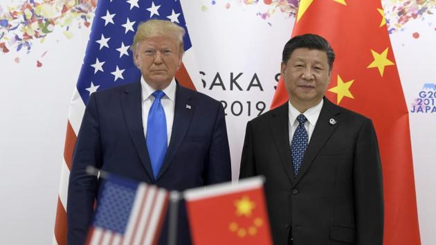 President Donald Trump, left, poses for a photo with Chinese President Xi Jinping during a meeting on the sidelines of the G-20 summit in Osaka, Japan, Saturday, June 29, 2019. (AP Photo/Susan Walsh)(AP)