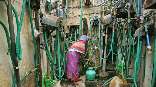 A woman uses a hand pump to fill up a container with drinking water in Chennai, Tamil Nadu. (P. Ravikumar / REUTERS) A woman uses a hand pump to fill up a container with drinking water in Chennai, Tamil Nadu. (P. Ravikumar / REUTERS)