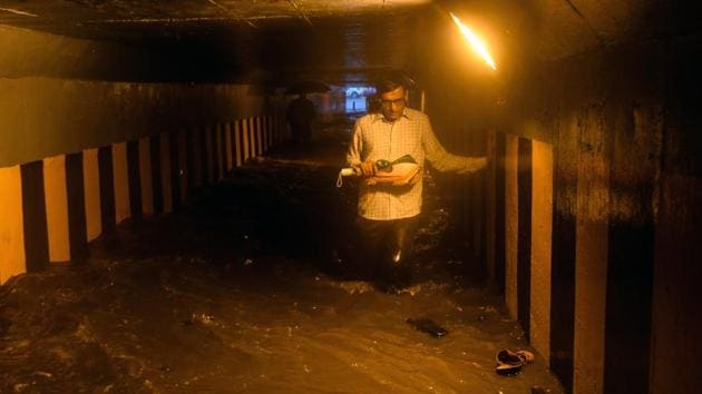 A man walks through a waterlogged subway. Sridhar Balasubramanian, associate professor, Indian Institute of Technology, Bombay said, “The low level westerly winds from Arabian Sea gained momentum and were able to push the cloud bands from the sea to land. For the past few days, these cloud bands were hanging in the sea, and on Friday, the winds were able to push them to the land.” (Shashi S Kashyap / HT Photo) A man walks through a waterlogged subway. Sridhar Balasubramanian, associate professor, Indian Institute of Technology, Bombay said, “The low level westerly winds from Arabian Sea gained momentum and were able to push the cloud bands from the sea to land. For the past few days, these cloud bands were hanging in the sea, and on Friday, the winds were able to push them to the land.” (Shashi S Kashyap / HT Photo)