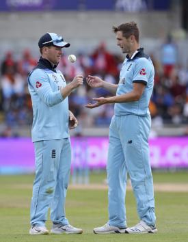 England's captain Eoin Morgan, left, speaks with England's Chris Woakes. (AP) England's captain Eoin Morgan, left, speaks with England's Chris Woakes. (AP)
