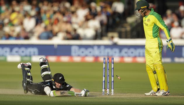 New Zealand's Tom Latham dives but makes his ground in attempted run out as Australia's wicketkeeper Alex Carey looks on. (AP) New Zealand's Tom Latham dives but makes his ground in attempted run out as Australia's wicketkeeper Alex Carey looks on. (AP)